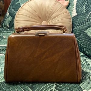 Vintage brown leather handbag with dual openings